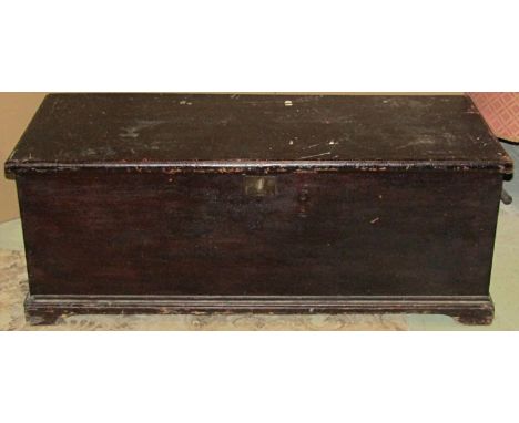 A 19th century stained pine blanket box with hinged lid, candle box and later simulated wood grain paper lined and raised on 