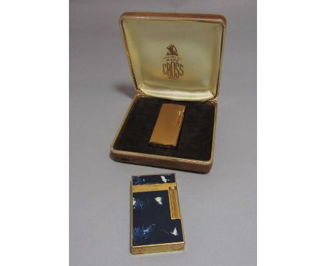 A S. T. Dupont lacque de chine cigarette lighter no IKOH 45, together with a gold cross plated cigarette lighter with brushed