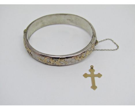 Aesthetic movement style hinged silver bangle with gold applied bird on branch decoration, together with a 9ct cross. 0.6g (2