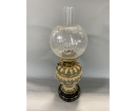 A good Lambeth type pottery oil lamp decorated in relief with birds and garlands 