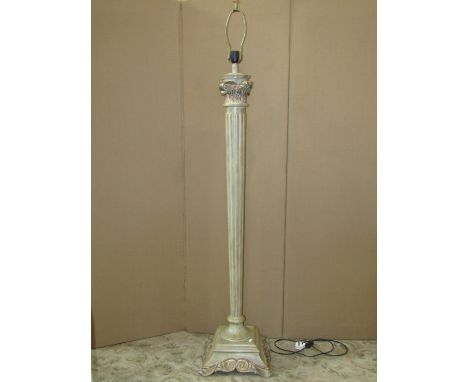 A contemporary lamp standard of column form with painted finish 