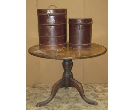 A Georgian oak snaptop table on turned pillar and tripod, two vintage tin canisters of circular form, an Indian occasional ta