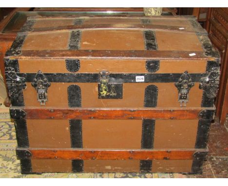 A late 19th century travel trunk with canvas timber lathe finish, with further metal fittings (locked)