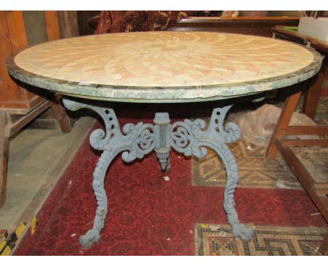 Good quality conservatory table, the circular stone top with geometric inlaid detail, raised on a cast iron tripod base, 120c