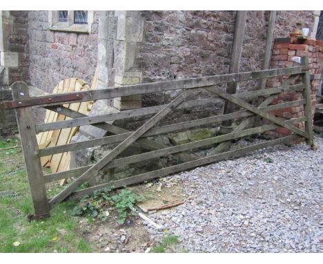 A weathered soft wood five bar field/entrance gate, 3.61 metres long (length excluding hinges x 120 cm high) 