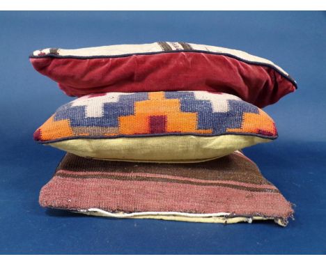 5 vintage kelim type cushions, largest 48 x 47cm, together with one further cushion with a carpet cover (6) CR- all cushions 