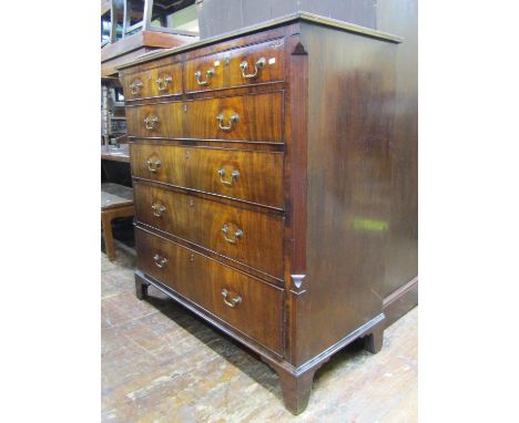 Georgian mahogany chest of four long and two short drawers with flame veneers set within canted corners, raised on bracket su