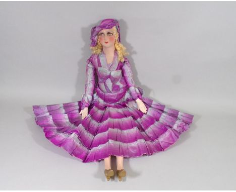 Unusual 1930's cloth doll in a Lenci style with soft moulded shoulder-head, painted features and applied eyelashes, soft stuf