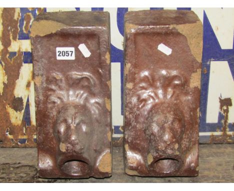 A pair of unusual salt glazed stoneware architectural bricks with lions mask water spouts, 30cm high x 14cm square approx (af