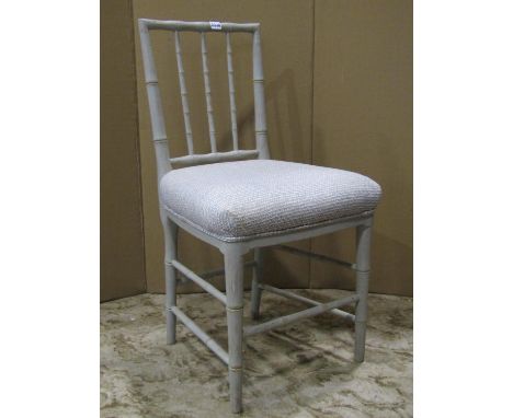 A contemporary chest of three drawers on short bracket supports and a painted chair with simulated bamboo moldings (2) 