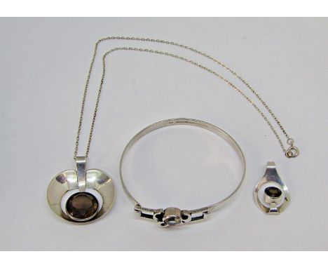 Group of Finnish silver gem set jewellery comprising two pendants set with smoky quartz and a further bangle (3) 