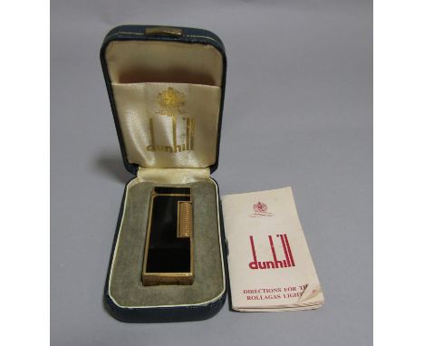 A Dunhill Rollagas pocket cigarette lighter in a black and gilt colourway (cased) 
