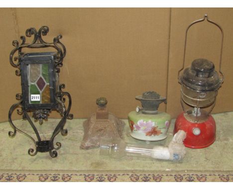 A vintage ironwork hanging porch lantern with coloured leaded light glass panels and simple scrollwork detail, together with 