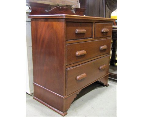 A mahogany  bedroom chest of two short over two long graduated drawers with moulded cup handles, shallow raised back and brac