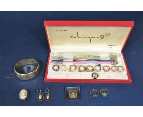 Mixed lot of jewellery to include two 9ct gem set dress rings, a gold plated bangle with engraved decoration, a cased Titoni 