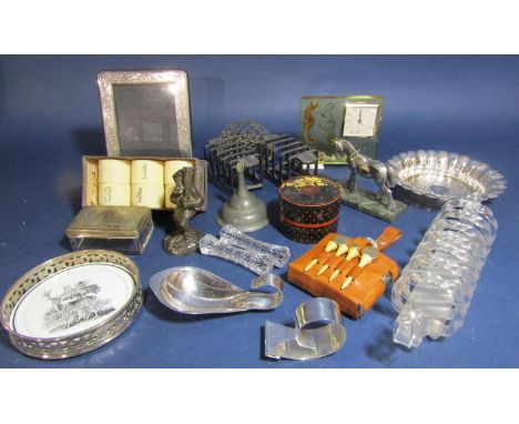 A mixed lot to include a cased set of six bone and bone numbered napkin rings, a lucite clock fitted with a sea horse, silver