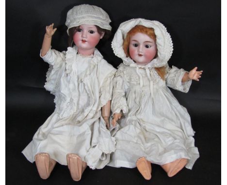 2 early 20th century German bisque head dolls; the taller doll 67cm has head by Armand Marseille, brown eyes, open mouth with