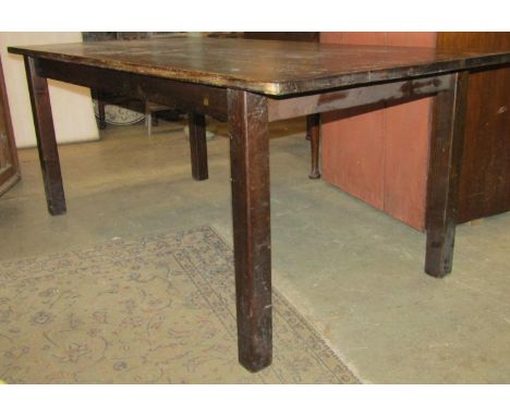 A pine kitchen table of rectangular form raised on square cut supports, together with five ladder back chairs, the table 185c