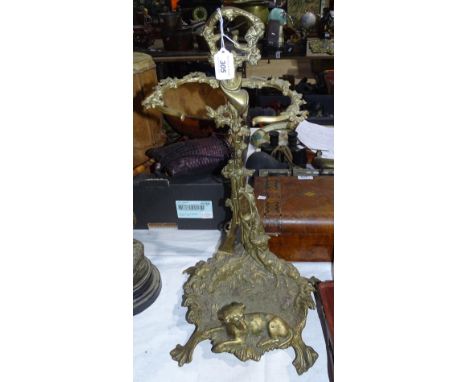 A cast-brass stick stand with dog figure