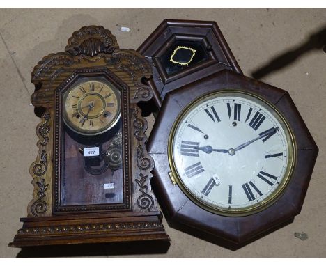 A carved oak-cased wall clock, 23", and another