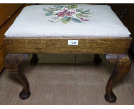 An Edwardian oak dressing stool, with tapestry upholstered seat, on cabriole legs, W53cm