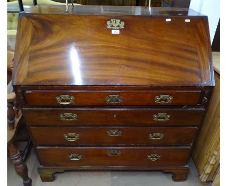 A George III mahogany bureau, the fall-front revealing a book design and inlaid fitted interior, with 4 long graduated drawer