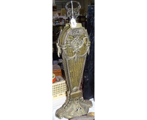 A brass peacock's tail design fireguard
