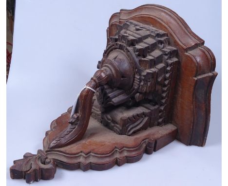An elaborately carved oak wall bracket, height 13.5"