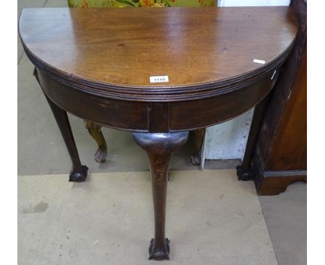 A 19th century mahogany bow-front fold over card table, raised on cabriole legs with claw and ball feet, W76cm