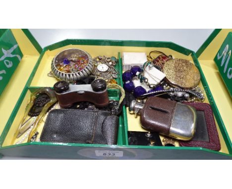 A box containing a silver plated and leather covered hip flask, a compact, opera glasses, a fob watch, costume jewellery etc