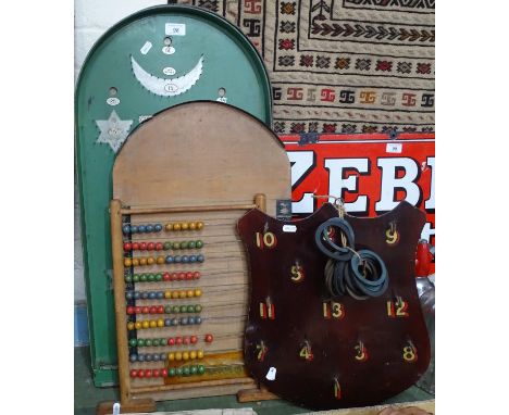 A shove ha'penny board, hoop-la, an abacus, and 3 bagatelle boards with balls