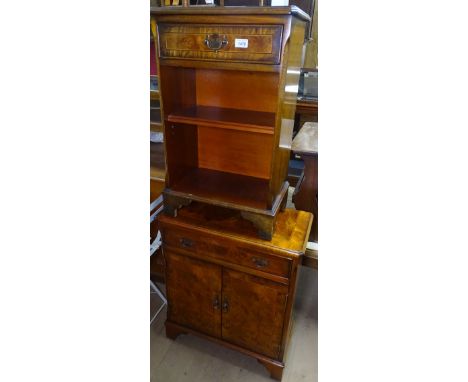 A reproduction cross-banded walnut cabinet, with single drawer and cupboards under, on bracket feet, and a similar cabinet wi
