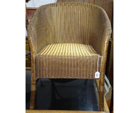 A gold Lloyd Loom bedroom chair