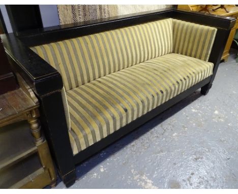 An Austrian Secessionist sofa circa 1900, ebonised and gilt decorated wood frame, with panelled ends, in the manner of Hoffma