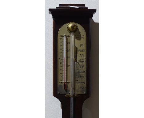 A mahogany stick barometer with thermometer