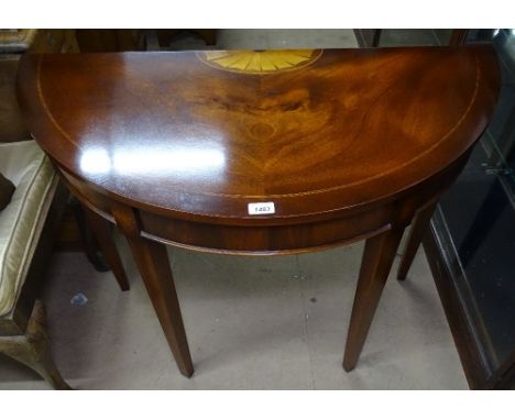 A reproduction mahogany demi lune console table, raised on tapered legs with marquetry inlaid decoration, w97cm 