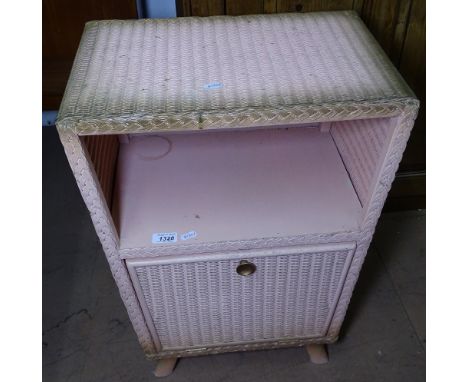 A pink Lloyd Loom bedside cabinet, W46cm