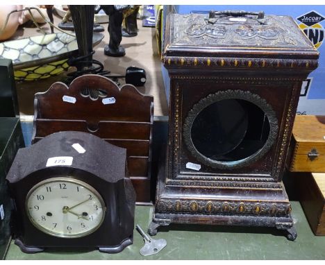 An ornate embossed clock case, 14.5", a 2-train Smiths clock, and a desktop stationery rack