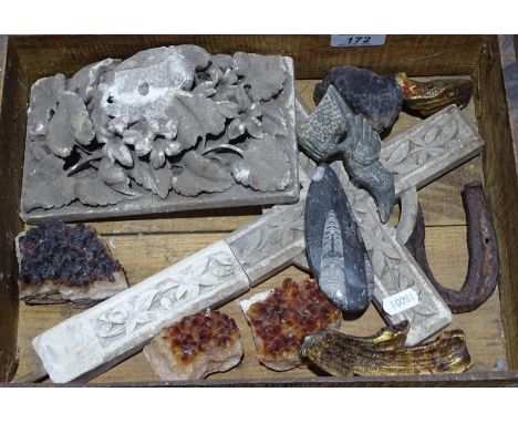 A carved plaster cross, minerals, a bird, a fossil etc