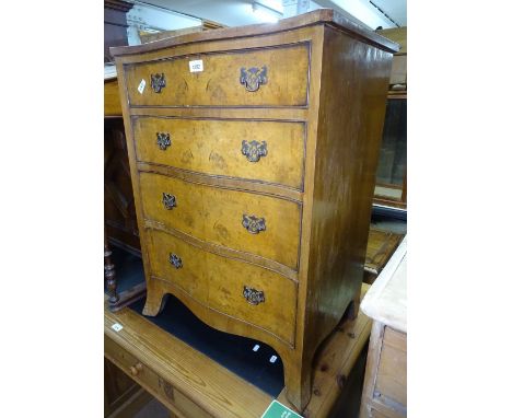 A reproduction walnut serpentine-front chest of 4 drawers, on bracket feet, W51cm