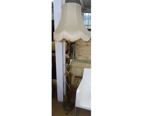 An ornate 19th century embossed brass standard lamp and shade, overall height 175cm