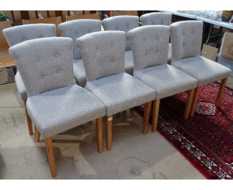 A set of 8 good quality modern dining chairs, with upholstered button backs, on oak tapered legs