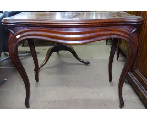 A 19th century mahogany serpentine-front fold over card table, raised on cabriole legs, W85cm