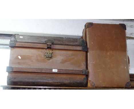 A metal dome-top travelling trunk, and 2 Vintage suitcases