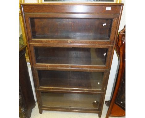 An oak four section Globe Wernicke style book case
