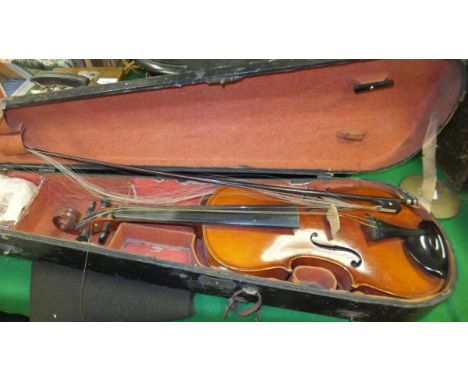 An early 20th Century violin bearing label inscribed "Copy of Antonius Stradivarius - Made in Czechoslovakia", together with 