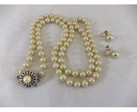 A pair of 9ct gold mounted pearl earrings, together with a pearl necklace