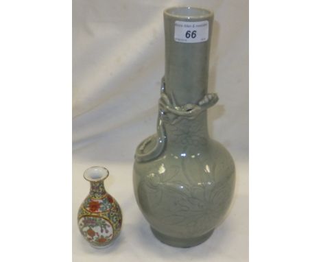 A Chinese celadon vase with applied dragon decoration, together with a small Chinese porcelain baluster shaped vase CONDITION
