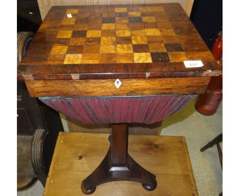 An early Victorian rosewood and inlaid games top sewing table on pedestal tripod base and squat bun feet