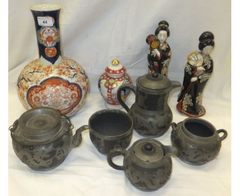 A collection of 20th Century Chinese teapot, hot water pot, sugar bowl and cream jug with pierced metal mounts depicting drag